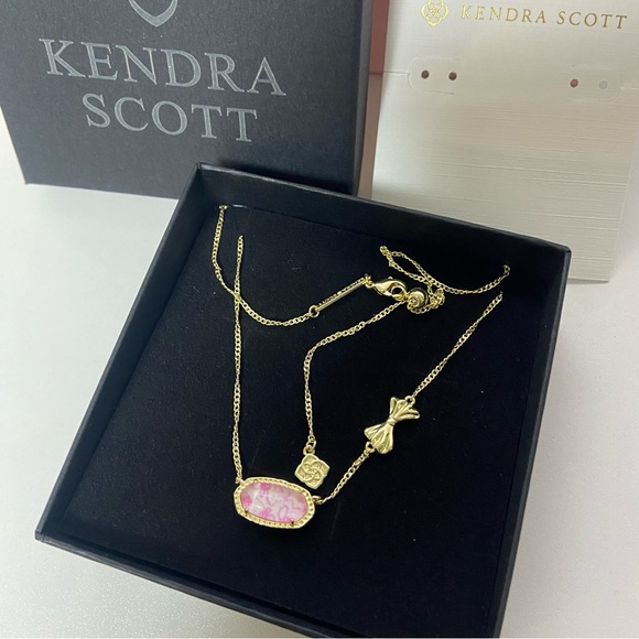 Kendra Scott Jewelry - Kendra Scott Gold Necklace with Pink Marbled Pendant and Bow Charm